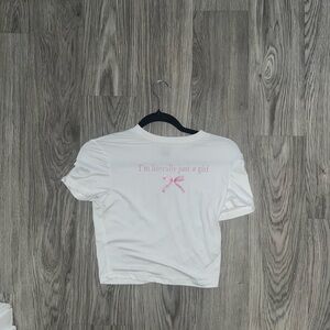 White crop top with pink lettering. Very coquette